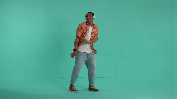 Young Man in Headphones Having Fun During Dance alt