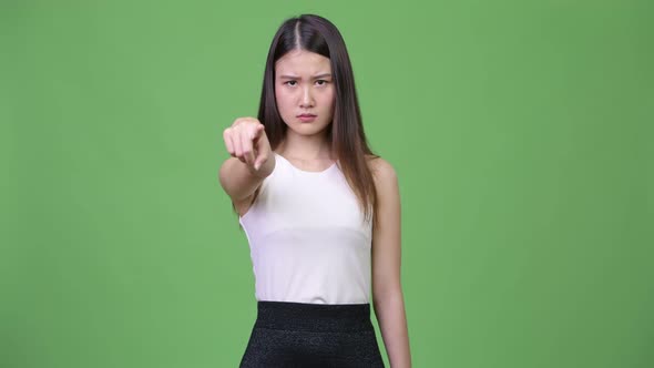 Young Beautiful Asian Businesswoman Pointing To Camera