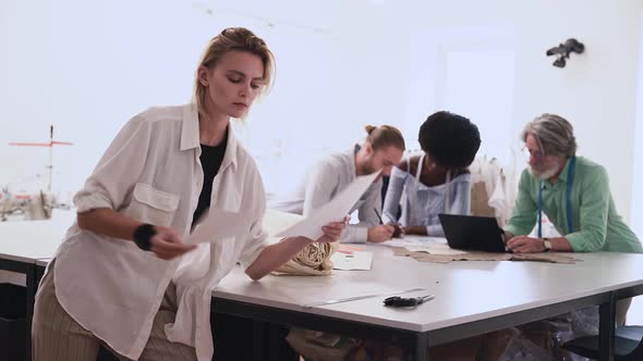 Multiethnic team of designers at work alt