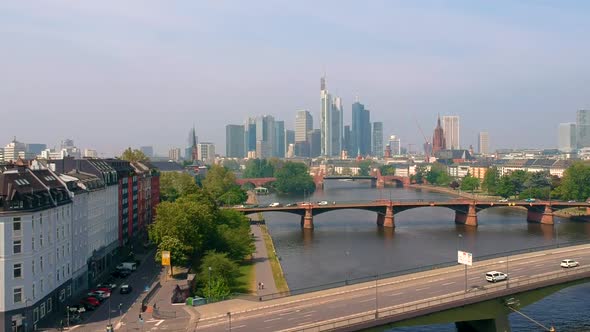 View Of Frankfurt City Skyline By The Main River With Daytime Traffic On Road Bridges In Frankfurt, alt