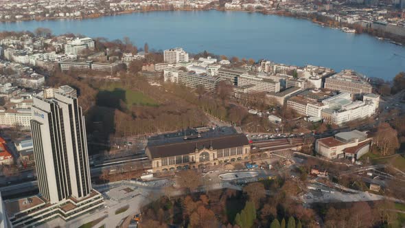 Wide Aerial View of a Train Arriving at Dammtor Train Station in Hamburg City Center alt