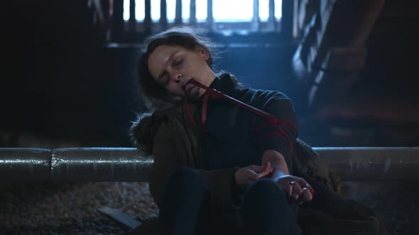 Young Woman Drugs Addicted Injecting Heroin in Arm alt