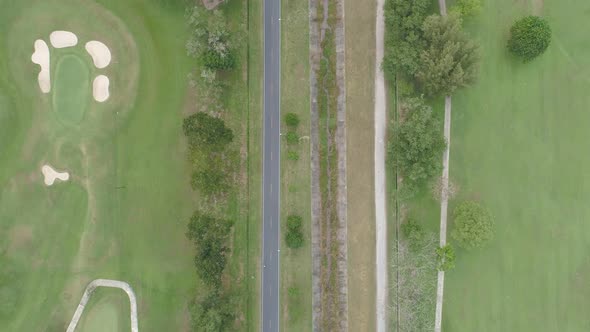 Aerial view of Golf Course with putting green grass and trees alt