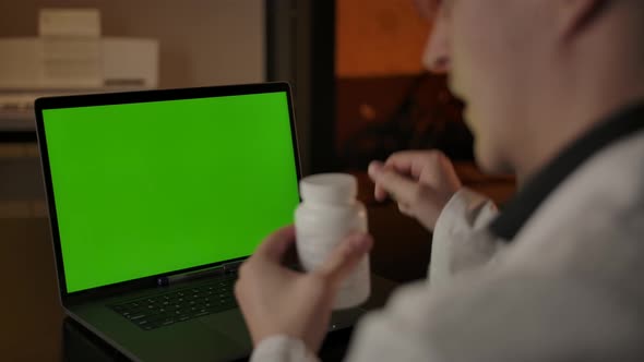 Caucasian Doctor Recommends Pills to Customer Online Via Video Call alt