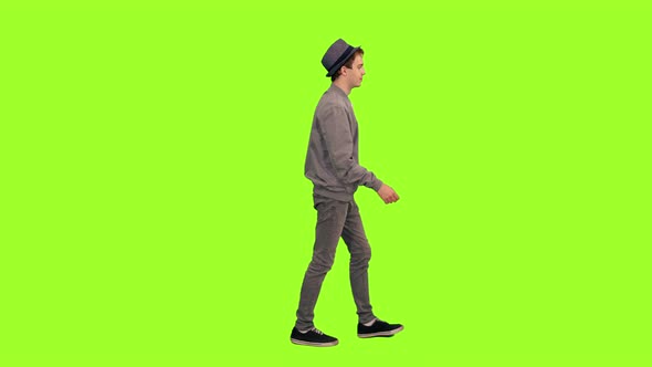 Young Stylish Man in Hat Walking