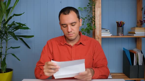 Young Business Man Gets Successful News Sits in Home Office alt