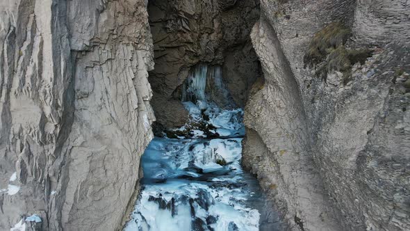 Sultan Waterfall Rushes Down in the DjilySu Tract in the Caucasus in Winter alt
