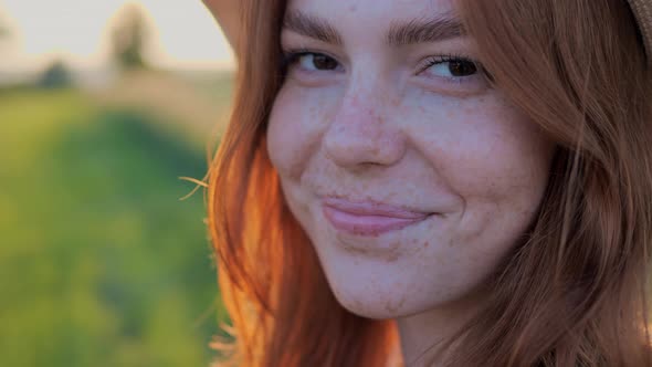 Happy Smiling Face in Summer Hat Female Ginger with Freckles Enjoying Nature alt