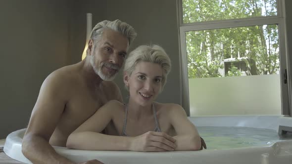 Couple relaxing in hot tub