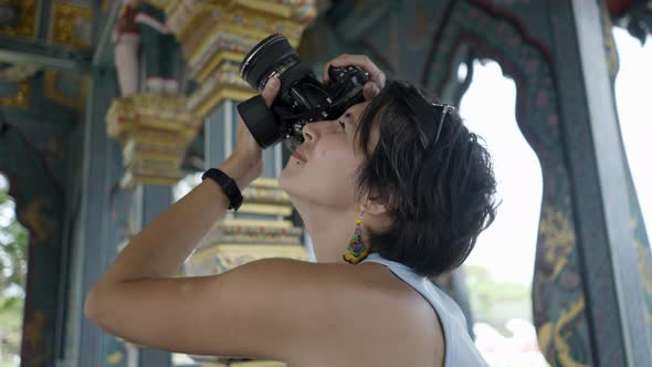 Beautiful Woman Takes Pictures Of Beautiful Architecture At Ancient City Museum Park In Thailand alt