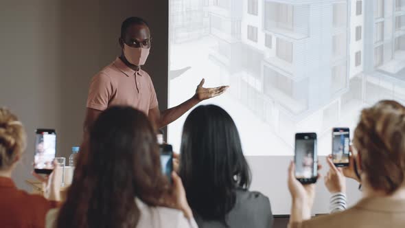 African American Speaker in Mask Giving Presentation on Conference alt