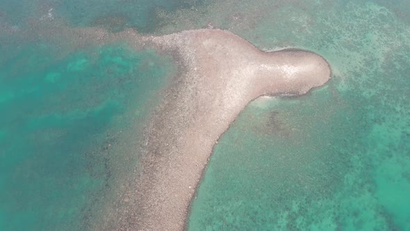 Aerial view of summer seascape with beautiful mild waves.