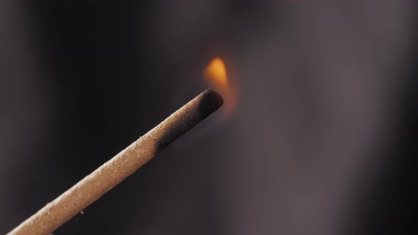 Incense Stick and Smoke From Incense Burning. Macro Close Up Lighter Fire and Beautiful Smoke. alt