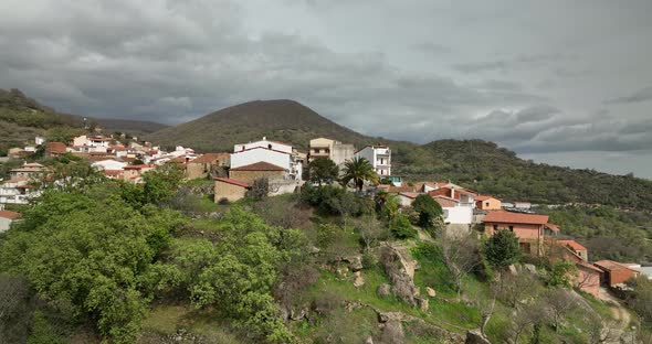 Stunning shoot of a village on the top of a hill alt