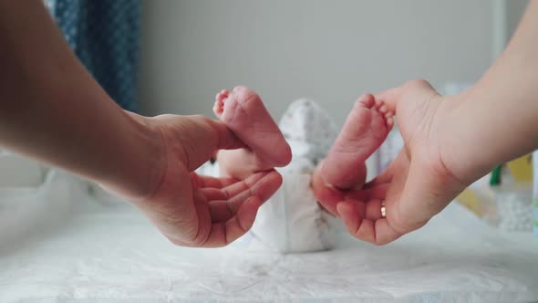 Little Legs of a Newborn Baby