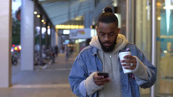 Slowmo Stylish Cool Urban Young Black Guy Bearded Walking Casual Relaxed Evening Downtown Shopping alt