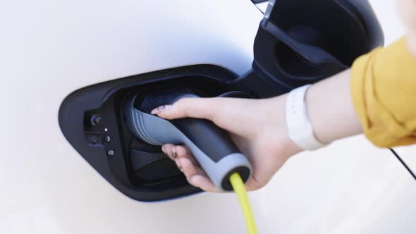 Electric Vehicle Charging Port Plugging in EV Modern Electric Car