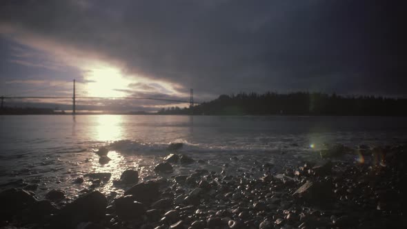 Calm morning ocean, Lions gate bridge in background alt