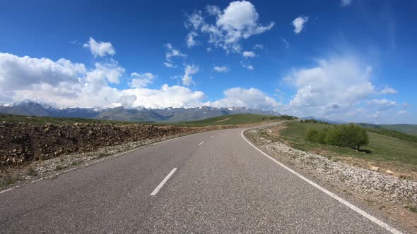 Point of View Driving a Car on a Road alt