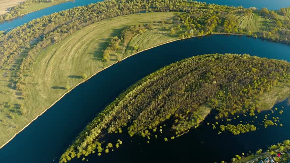 Aerial View Green Forest Woods And Curved River Landscape In Sunny Spring Day alt