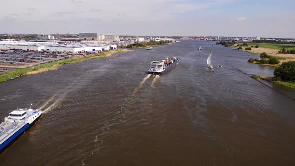 Inland Freighter Barges Sailing In The Oude Maas River At Daytime In Area Of Zwijndrecht, Netherland alt
