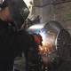 Worker in Protective Mask Welding Metal Construction at Metalworking Factory - VideoHive Item for Sale