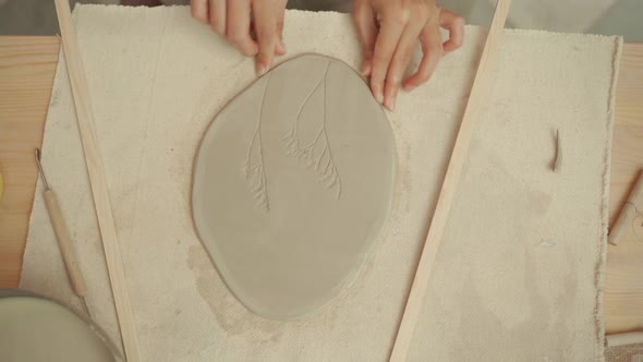 Ceramist Making Handmade Clay Plate