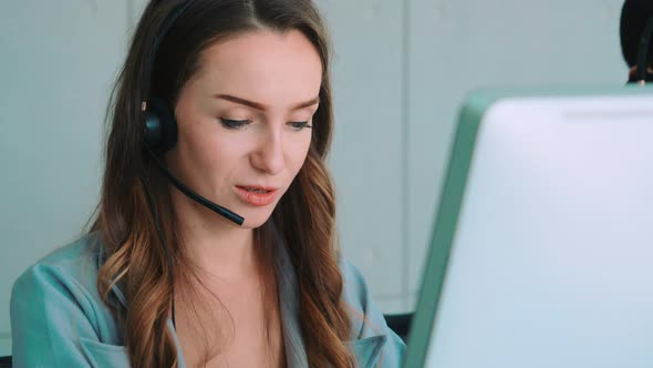 Business People Wearing Headset Working in Office alt