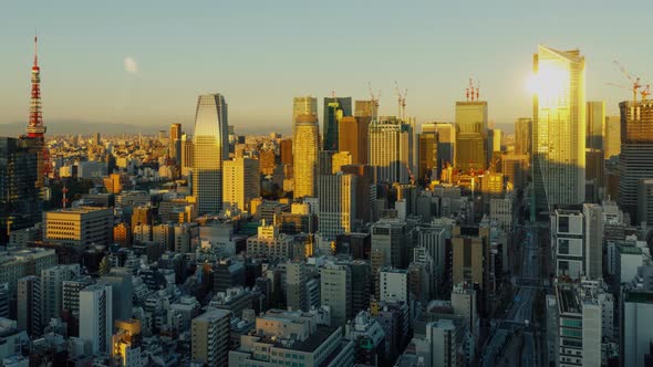 Time Lapse of the densely packs buildings of Tokyo Japan at sunrise alt
