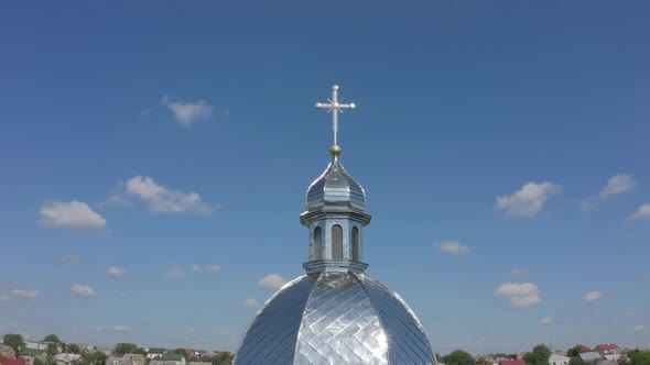 Dome of Church. Aerial View. Traditional Old Church in Ukraine Small Village. Blue Sky Background alt