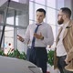 Sales Manager and Client Near a New Car with an Open Hood - VideoHive Item for Sale