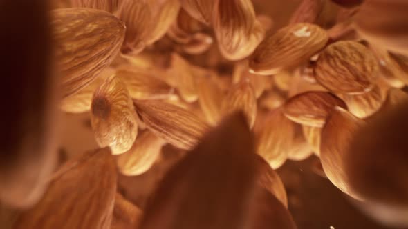Super Slow Motion Detail Shot of Almonds Flying Towards Camera at 1000 Fps alt