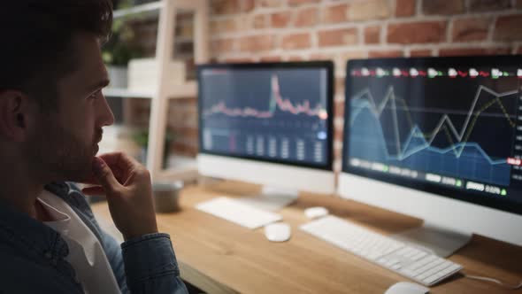 Adult man following stock market data. Shot with RED helium camera in 8K alt