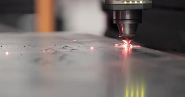 Factory Automated Laser Cutter Working And Cutting Stainless Metal Sheet.