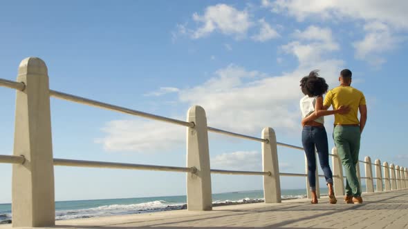 Couple walking together in the beach on a sunny day 4k alt