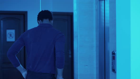 African American Businessman with Document Clipboard Encountering Creepy Zombies at Elevator at alt