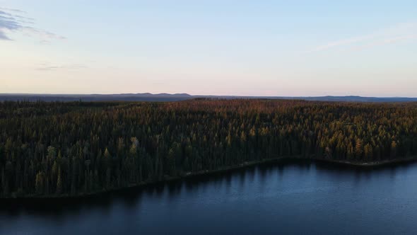Stunning and tranquil Cobb Lake deep in the forests of British Columbia, Canada. Wide angle aerial s alt