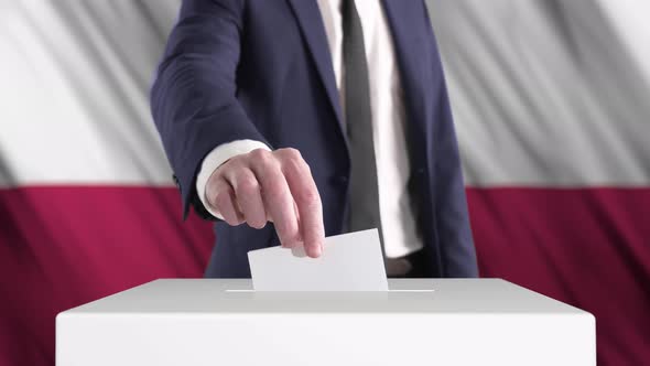 Voting. Man Putting a Ballot into a Voting Box with Poland Flag on Background.