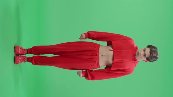 Full Body Of Terrible Asian Transgender Male Looking At Camera In The Green Screen Studio alt