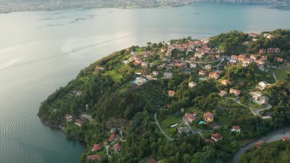 Fly Over a Small Village with Traditional Colorful Italian Houses Olgiasca Italy alt