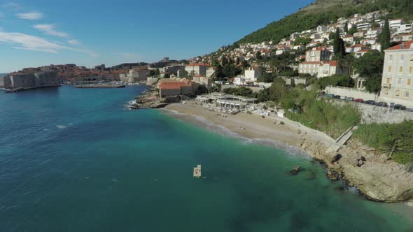 Aerial shot of Banje Beach and the old port alt