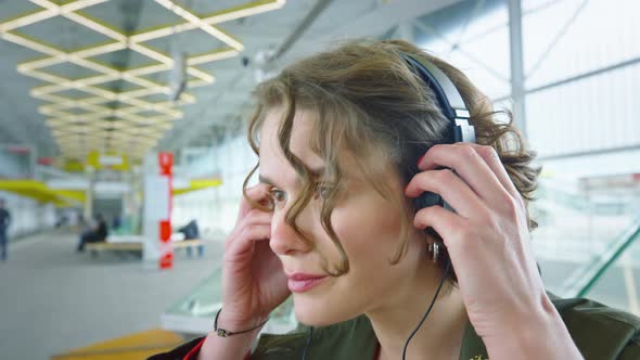 Young Woman Walk in Urban Space Listen to Music alt
