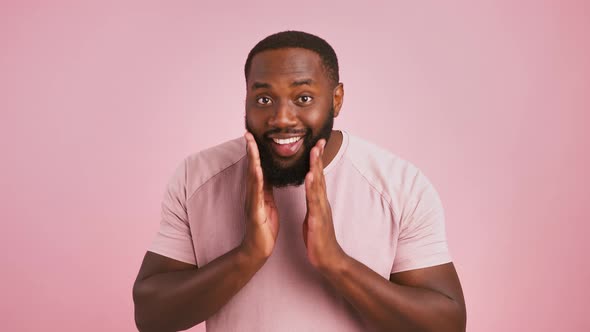 Playful African American Man Preening His Beard Winking to His Mirror Reflection at Camera Pink alt