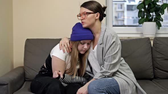 Mom Hugs Her Teenage Daughter and Comforts Her