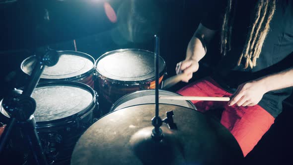 Drum Kit is Getting Hit Rhythmically While Recording Music alt