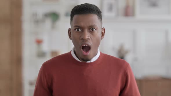 Portrait of Disappointed African Businessman Reacting to Loss alt