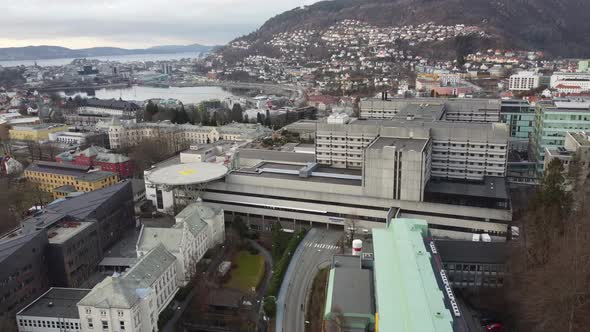 Haukeland hospital with Bergen city in background - Upwarding aerial close to hospital buildings wit alt