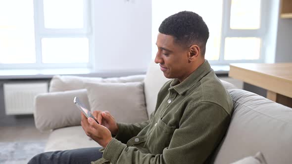 Handsome Guy is Using Smartphone for Messaging Texting