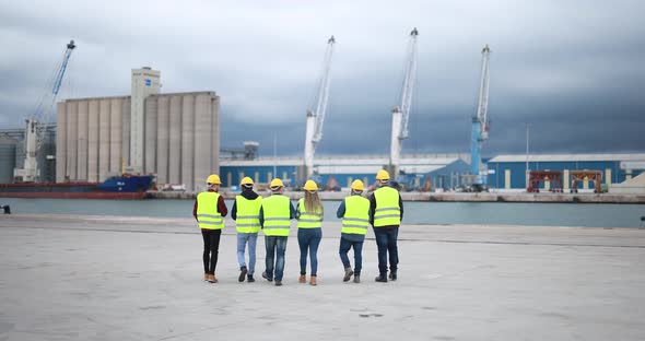 Multiracial people working together at industrial port outdoor alt