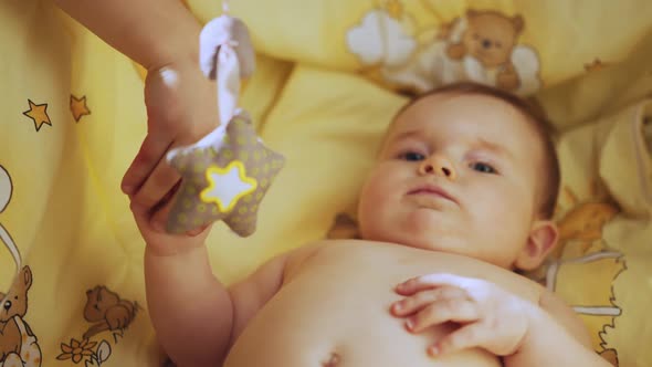 Close Up Footage of Newborn Baby Playing With Mother's Hand and Finger While alt